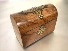 A Victorian brass-mounted walnut dome-top stationery box, the cover and lock plate with shaped