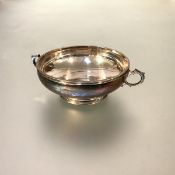 A George V silver twin-handled bowl, William Comyns & Sons, London 1934, on a stepped circular foot,