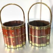 A pair of brass-mounted mahogany peat or log buckets, each of fluted cylindrical form, decorated