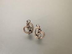 Georg Jensen, a pair of sterling silver earrings, of heart shape incorporating a leaf sprig,