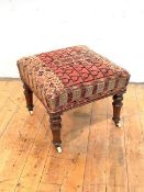 A Victorian rosewood stool, the overstuffed and sprung square seat upholstered in a kelim fabric,