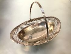A George V silver swing-handled cake basket, Robert Pringle and Sons, Birmingham 1914, in 18th