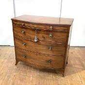 A George III mahogany bowfront chest, late 18th century, the top with reeded edge over a brushing