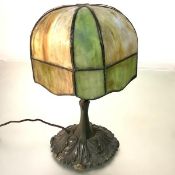 An American patinated bronze table lamp, first quarter of the 20th century, the domed base cast with