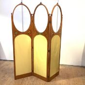 A Sheraton Revival painted satinwood room divider screen, c. 1900, each oval glazed and silk-