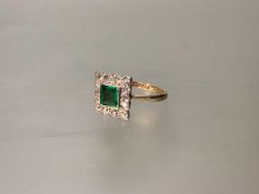 An 18ct gold and platinum, emerald and diamond cluster ring in the Art Deco taste, the collet-set