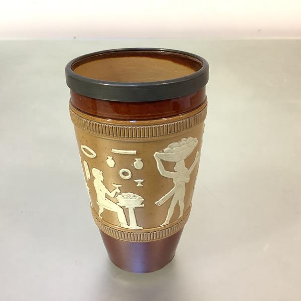 A Royal Doulton stoneware beaker, 1920's, in the Egyptian Revival taste, sprigged with a band of