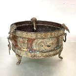 An Indian copper and brass brazier, probably late 19th century, of circular form, the side with