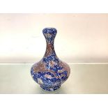 A Chinese blue and white porcelain vase, of shaped baluster from, the waisted neck terminating in