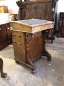 A Victorian figured walnut davenport, the hinged sloped top with inset skiver writing surface,