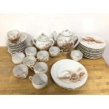 A 1920s/30s Japanese teaset, including teapot (19cm), ten teacups, eleven saucers, eleven side