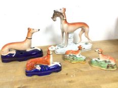A group of 19thc Staffordshire whippets (tallest: 19cm) (a/f)