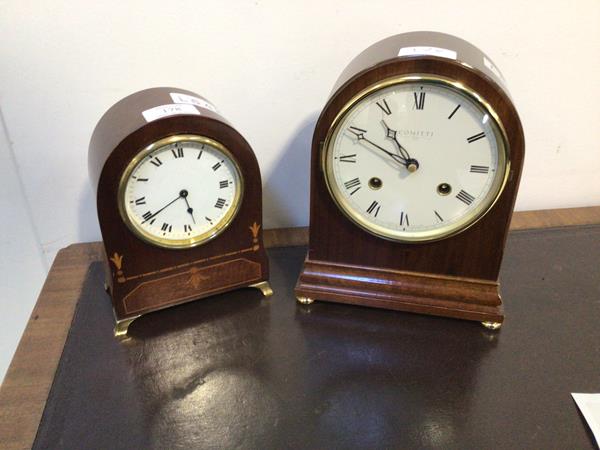 An Edwardian mahogany dome top mantel clock with sandalwood inlays, the white enamel dial with Roman