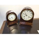 An Edwardian mahogany dome top mantel clock with sandalwood inlays, the white enamel dial with Roman