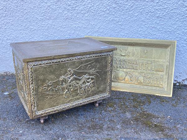 A hammered brass coal box, the exterior decorated with coaching scenes, the hinged lid revealing a