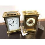 A small late 19thc brass and four glass carriage clock, the white enamelled dial with roman
