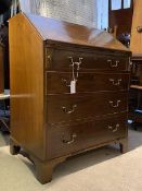 An Edwardian mahogany bureau, in the George III taste, the fall front revealing a baize lined