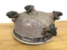 Iain Nelson, a Studio Pottery pie dish and cover with multiple ram's heads, some losses, signed to