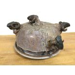 Iain Nelson, a Studio Pottery pie dish and cover with multiple ram's heads, some losses, signed to