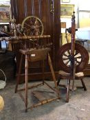 A 20thc stained walnut treddle spinning wheel together with a pitch pine spinning wheel (both a/