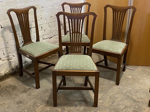 A set of four Georgian style mahogany dining chairs, with shaped crest rail, pierced splat, with