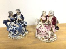 A near pair of porcelain figures, both depicting Couples on Bench, one in blues, the other in pinks,