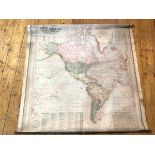 A c.1900 wall map, Scarborough's Map of the World with North and South America to one side, the