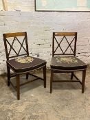 A pair of early 19thc mahogany dining chairs, the crossbanded crest rail above double X back, with