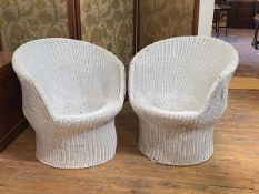 A pair of 20th century white painted wicker verandah tub shaped chairs of cylindrical form