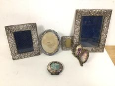 A collection of photograph frames including a circular Birmingham silver frame (6.5cm), two rococo