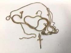 A group of chains, two marked 9k, one marked 10k, one yellow metal and an ankh 9ct gold pendant (
