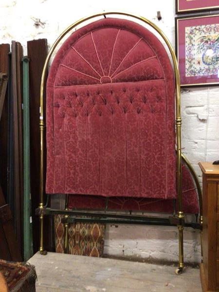 An impressive Edwardian four foot single bedstead, the tubular brass head and footboard with