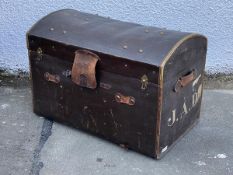 An early 20thc dome top travelling trunk, the exterior bearing initials JAD., the interior with