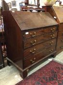 An Edwards & Roberts late 19thc bureau, the fall front revealing an interior fitted drawers and