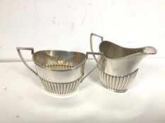 A Sheffield silver half lobed milk jug (9.5cm) and sugar bowl (combined: 248g)