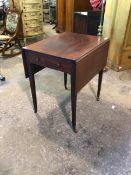 A Georgian mahogany pembroke table, the top with two drop leaves above frieze drawer, raised on