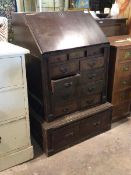 An early 20thc bureau, the fall front revealing an interior fitted drawers and correspondence