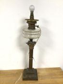 A converted gas lamp, the glass reservoir on a Corinthian column on square base (63cm)