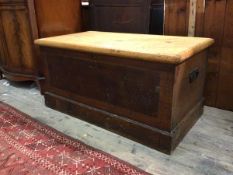 A Victorian stripped and stained pine blanket box, the hinged lid revealing candle tray to interior,