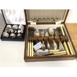 A cutlery canteen with quantity of Epns, a boxed set of Epns napkin rings and place holders in the