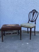 An Edwardian mahogany side chair in the Hepplewhite manner, the scalloped shield back with pierced