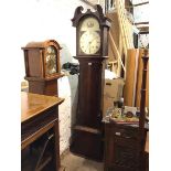 An early 19thc mahogany longcase clock with unusual painted dial, roman numerals and depiction of