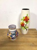 A Poole Pottery vase, of baluster form with foliate decoration, stamped Poole to base (14cm) and a