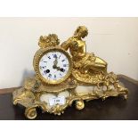 A late 19thc/early 20thc French figural cast gilt metal and alabaster mantel clock, white enamel