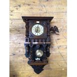 A late Victorian walnut cased regulator wall clock, the case surmounted by an associated eagle