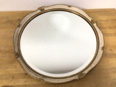 A modern circular mirror, the bevelled glass within a parcel gilt frame (39cm)