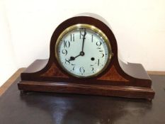 An Edwardian dome top inlaid mahogany cased mantel clock, the white enamelled dial with arabic