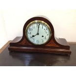 An Edwardian dome top inlaid mahogany cased mantel clock, the white enamelled dial with arabic