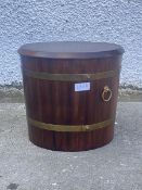 A 20thc mahogany lidded log or coal bucket, the brass bound tapering cylindrical body with carry