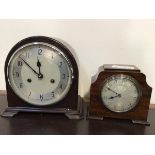 A vintage Enfield mantel clock in a bakelite case with silvered dial, striking hammer on coil